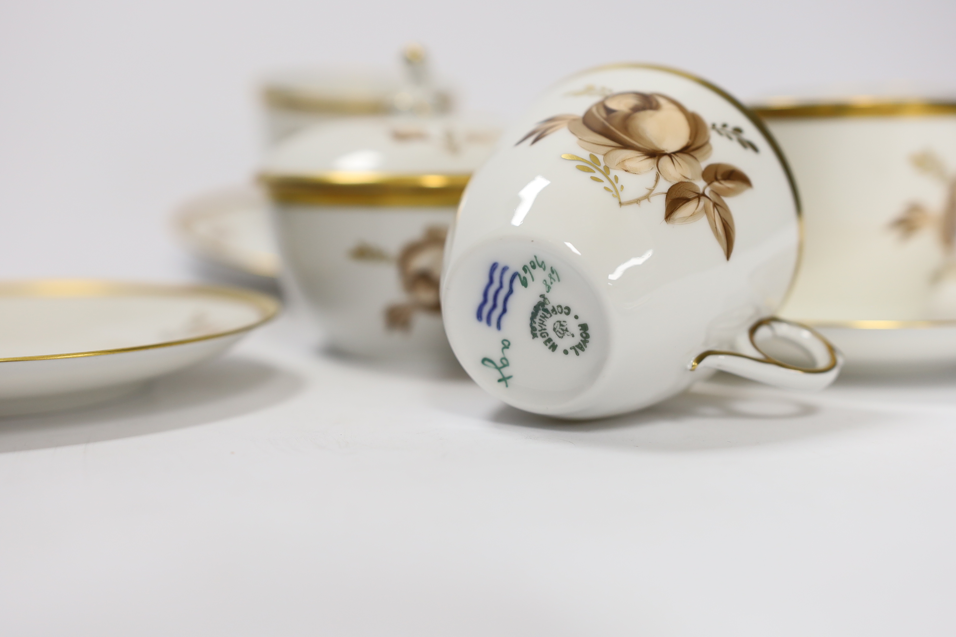 A Royal Copenhagen part coffee set comprising six cups and saucers and a jar and cover, largest 12.5cm in diameter